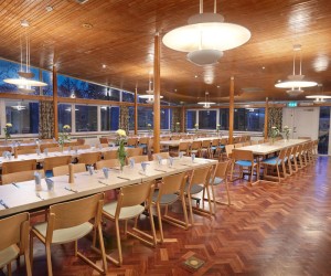 Large breakout canteen with modern wooden seating and tables