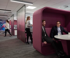 Pink meeting pod with high back and side walls