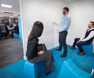 Turquoise blue meeting zone with contemporary stool seating