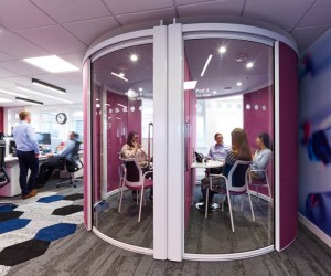 Pink round meeting pod with glass door and internal partition