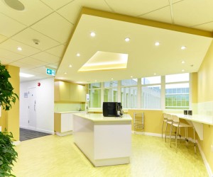 open plan office kitchen in bright sunshine yellow colours